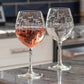 Mellow Monkey 18-oz balloon red wine glasses with etched school of fish design on clear glass