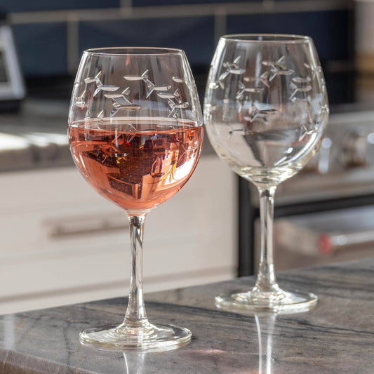 Mellow Monkey 18-oz balloon red wine glasses with etched school of fish design on clear glass