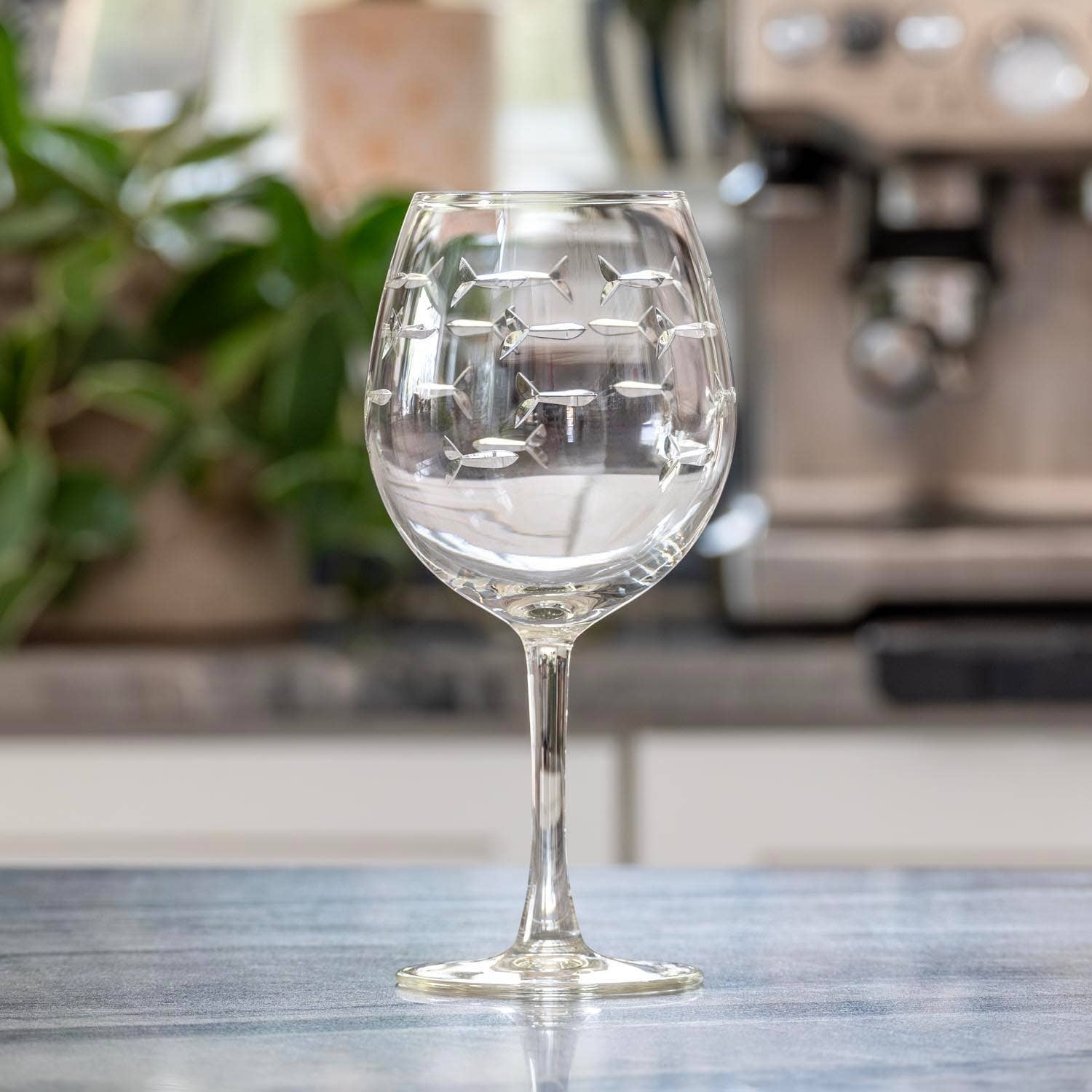 Mellow Monkey 18-oz balloon red wine glass with etched school of fish design on clear domestic glass
