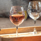 Mellow Monkey 18-oz balloon red wine glass featuring an etched school of fish design on clear domestic glass.