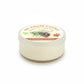 Mellow Monkey Evergreen Forest Pet House mini candle in a clear jar with a pine cone and paw print label design