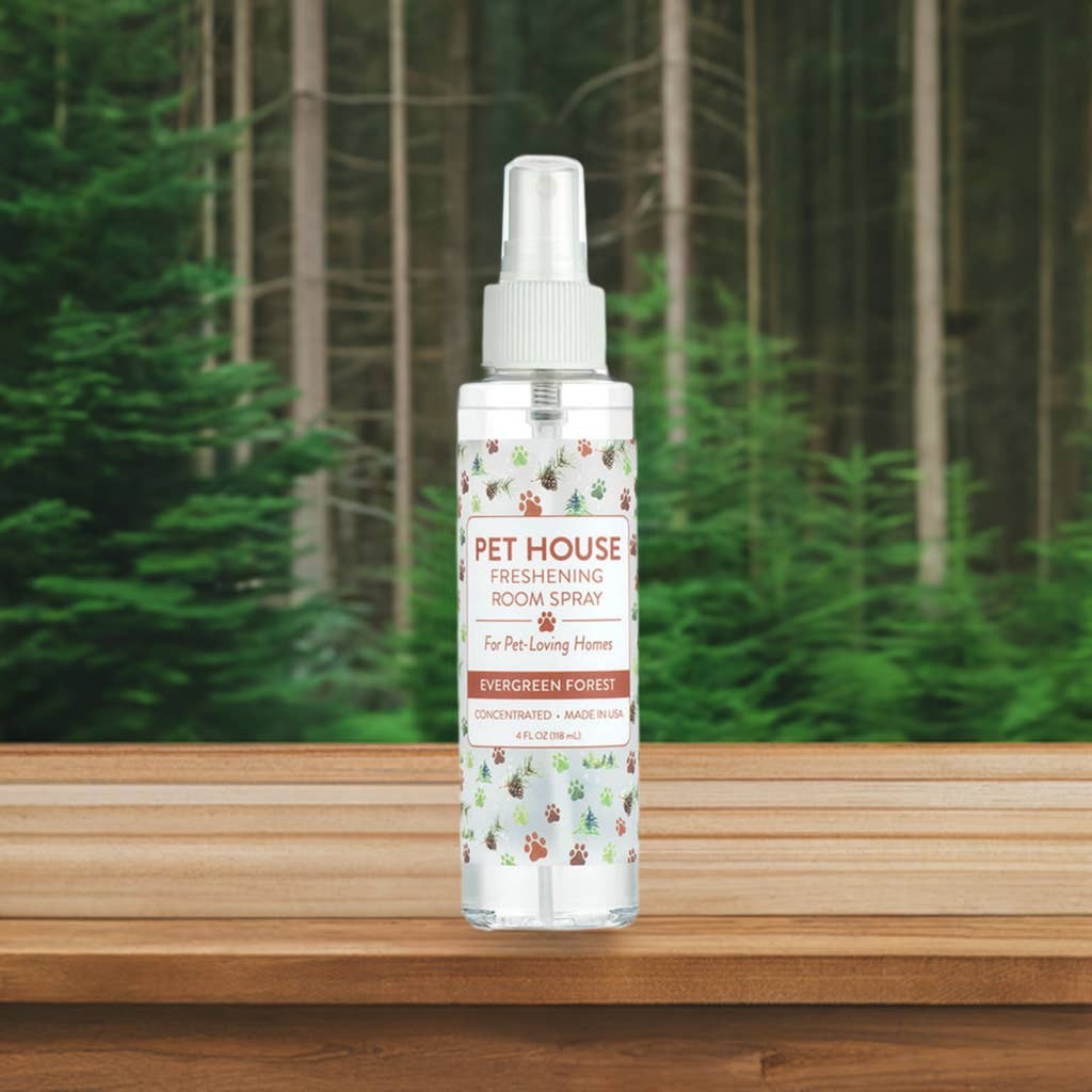 Mellow Monkey Evergreen Forest pet odor neutralizing room spray in a 4-ounce clear bottle against a forest background.