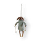 Mellow Monkey handcrafted wool felt dog ornament wearing a quilted coat and holding skis for winter holiday decor