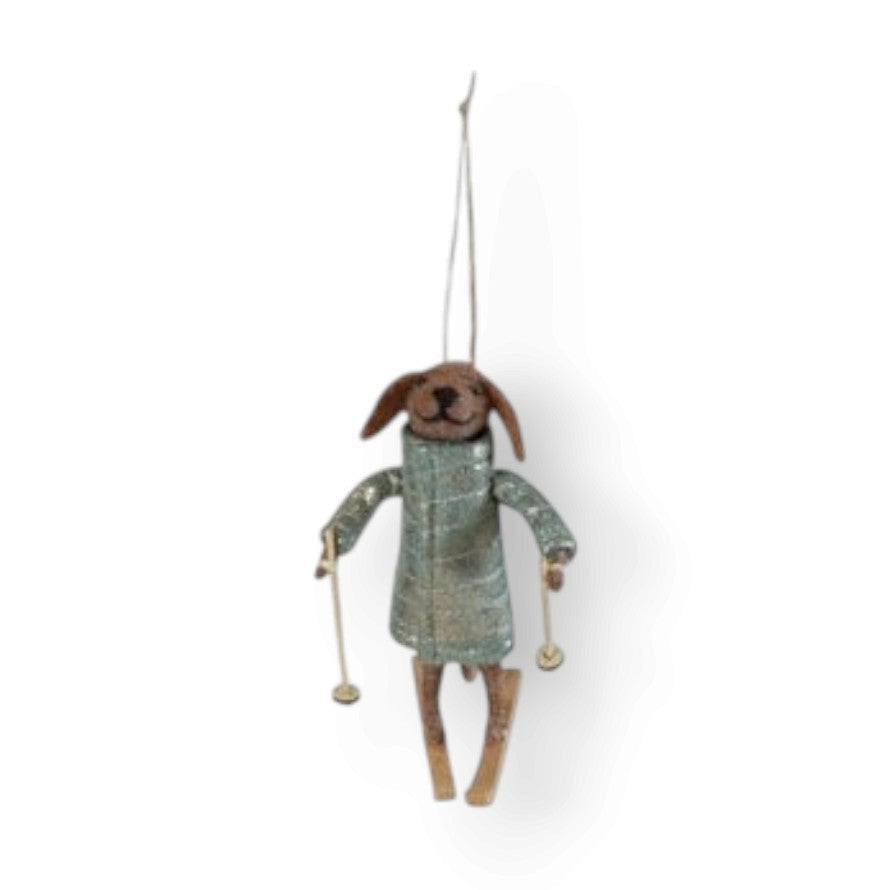 Mellow Monkey handcrafted wool felt dog ornament wearing a quilted coat and holding skis for winter holiday decor