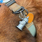 Mellow Monkey Kobe Identification Charm shaped like a silver fire hydrant attached to a dog collar