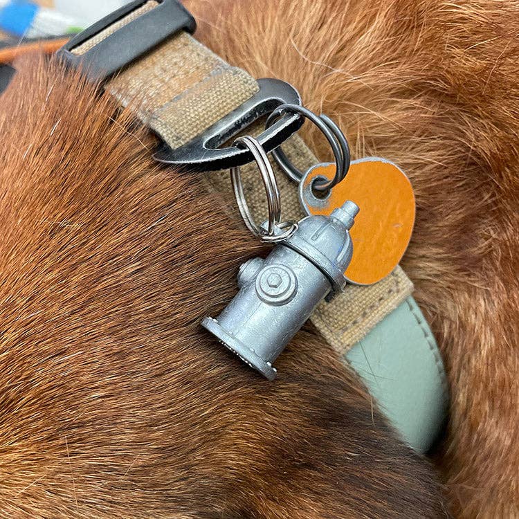 Mellow Monkey Kobe Identification Charm shaped like a silver fire hydrant attached to a dog collar