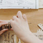 Mellow Monkey 3D laser cut wooden fishing ship puzzle being assembled. Natural wood pieces.