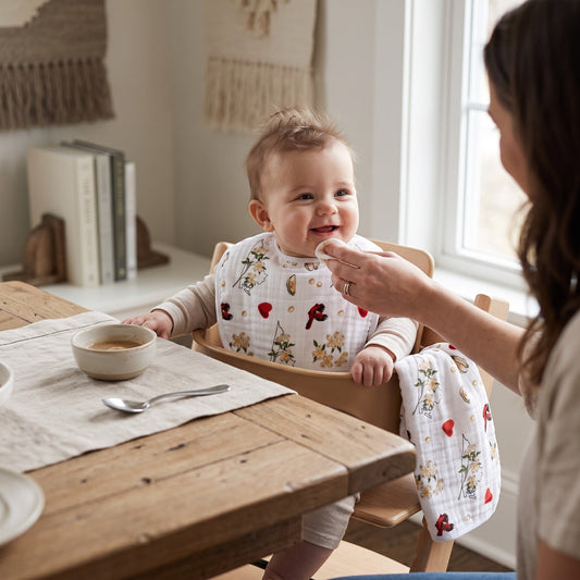 Mellow Monkey 2-in-1 floral baby bib and burp cloth in bamboo cotton blend with red heart and flower print