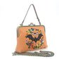 Mellow Monkey linen blend handbag featuring an embroidered bat and floral wreath with a vintage bronze kiss lock.