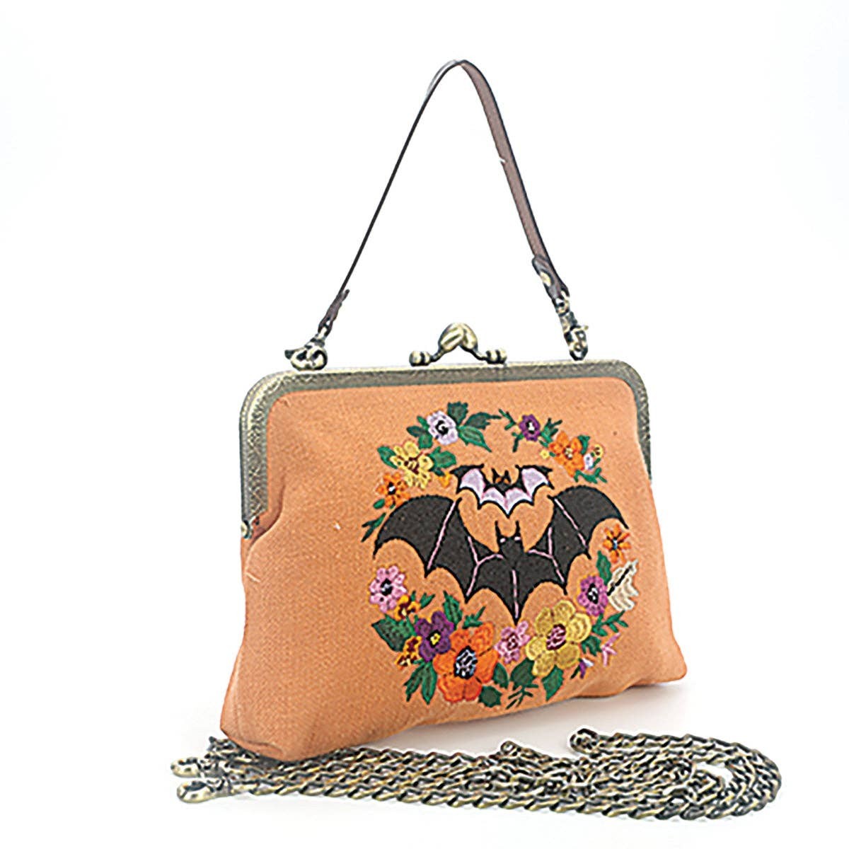 Mellow Monkey linen blend handbag featuring an embroidered bat and floral wreath with a vintage bronze kiss lock.