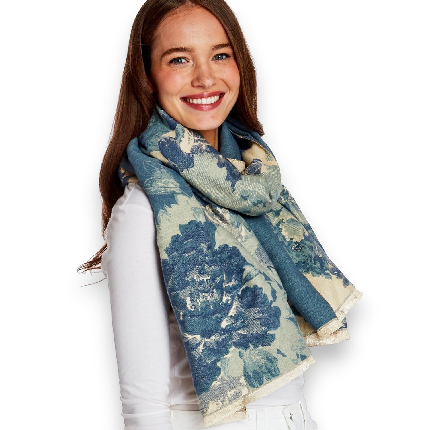 Mellow Monkey double-sided blue and cream floral shawl scarf with eyelash fringe worn by a smiling woman