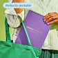 Mellow Monkey FlowArt dot-by-letter activity book with a purple cover being placed into a green tote bag.
