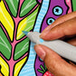 Mellow Monkey FlowArt meditative coloring kit showing a hand using a marker to fill in a vibrant leaf pattern