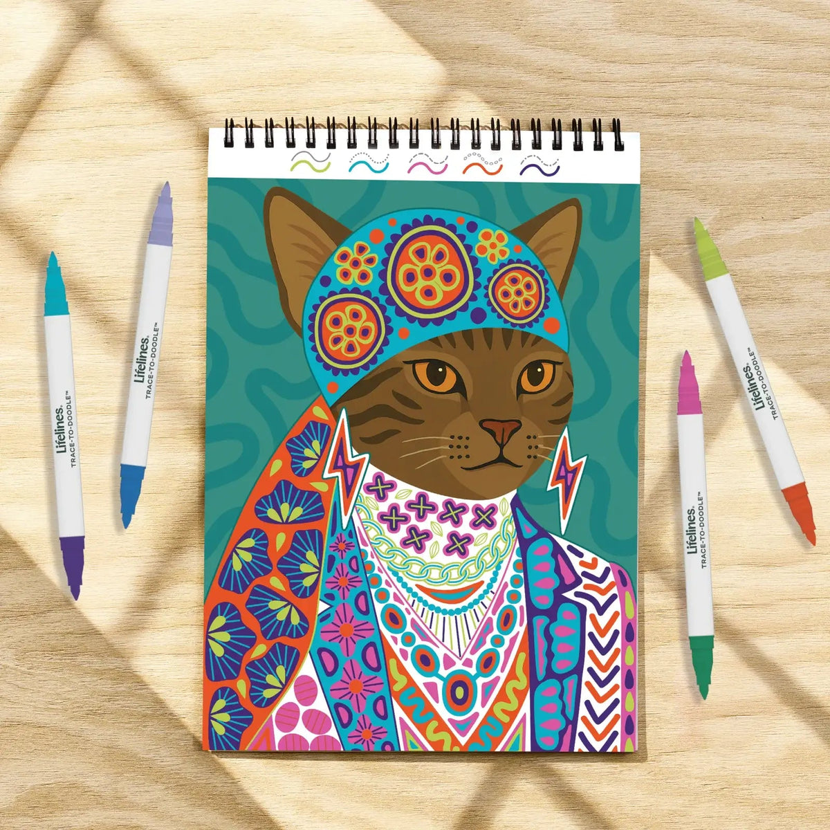 Mellow Monkey Lifelines FlowArt Trace to Doodle pad featuring a colorful cat illustration with four markers