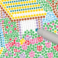Mellow Monkey Cozy Cottage FlowArt Dot by Letter activity pad with colorful dotting markers on a guided scene