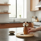 Mellow Monkey fox-shaped salt and pepper mill made of acacia wood with faux leather ears on a kitchen counter