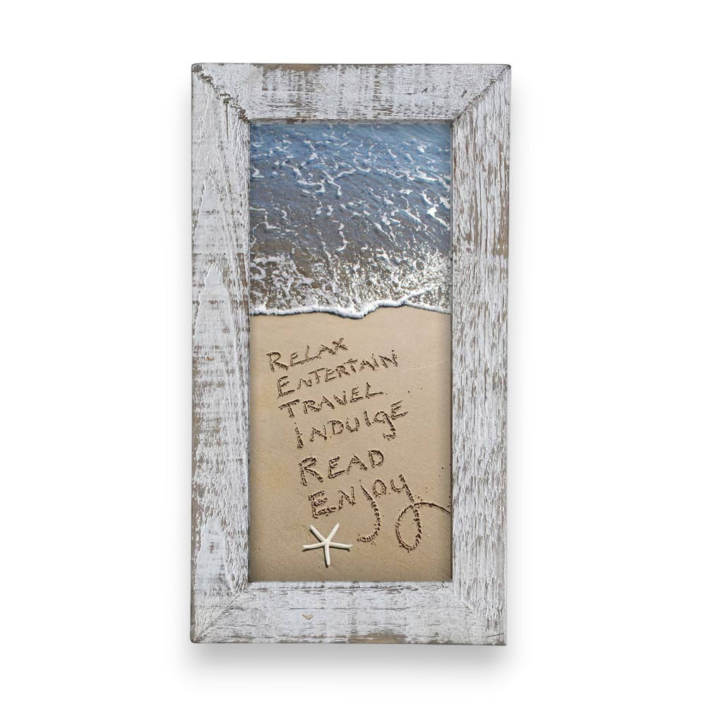Mellow Monkey framed beach art with words "Relax, Entertain, Travel, Indulge, Read, Enjoy" written in sand and a starfish. Rustic white wood frame.