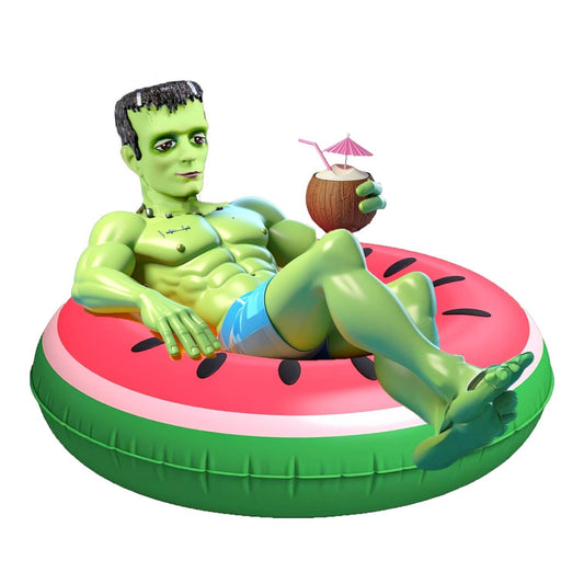 Mellow Monkey December Diamonds Frankenstein's monster in a watermelon float holding a coconut drink.