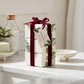 Mellow Monkey Frasier Fir bar soap trio wrapped in white paper with pine print and a deep red velvet ribbon.
