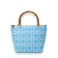 Mellow Monkey French Blue Buckle tote bag with bamboo handles and geometric pattern. Top zip closure.