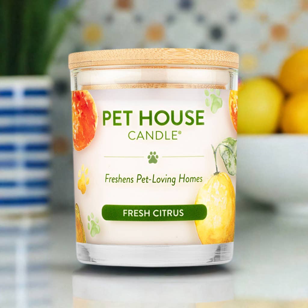 Mellow Monkey Pet House Candle in Fresh Citrus scent with a bamboo lid, featuring orange and lemon illustrations.