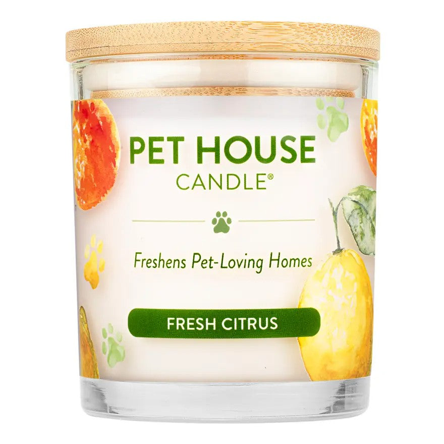 Mellow Monkey Pet House Candle in Fresh Citrus scent with a bamboo lid and decorative orange and lemon illustrations.