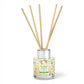 Mellow Monkey Pet House reed diffuser in Fresh Citrus scent with orange and lemon print glass bottle and wood reeds.