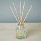Mellow Monkey Pet House Fresh Citrus reed diffuser in a glass bottle with wooden reeds for neutralizing pet odors