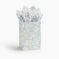 Mellow Monkey small frosted poinsettia gift bag with gloss finish, twisted paper handles, and matching tissue paper.