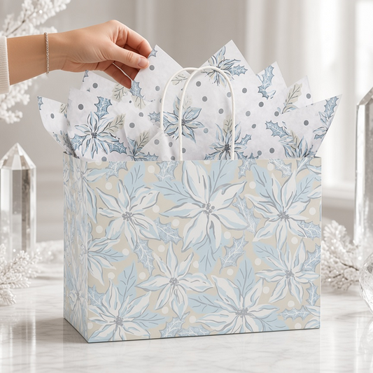 Mellow Monkey large frosted poinsettia gift bag with gloss print, twisted handles, and included decorative tissue.