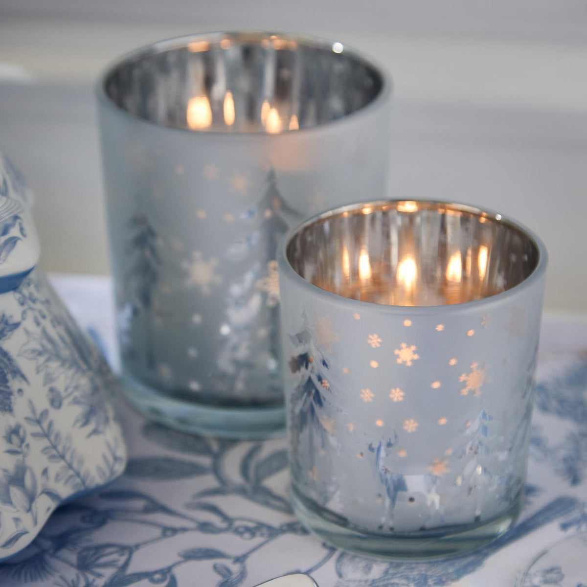Mellow Monkey set of frosted glass tealight candleholders with winter woodland deer and tree silhouettes