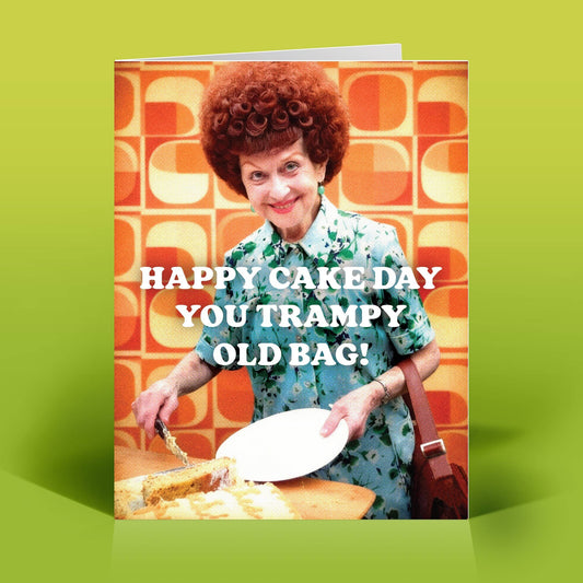 Mellow Monkey funny birthday card featuring a retro woman with red hair cutting a cake, text reads Happy Cake Day