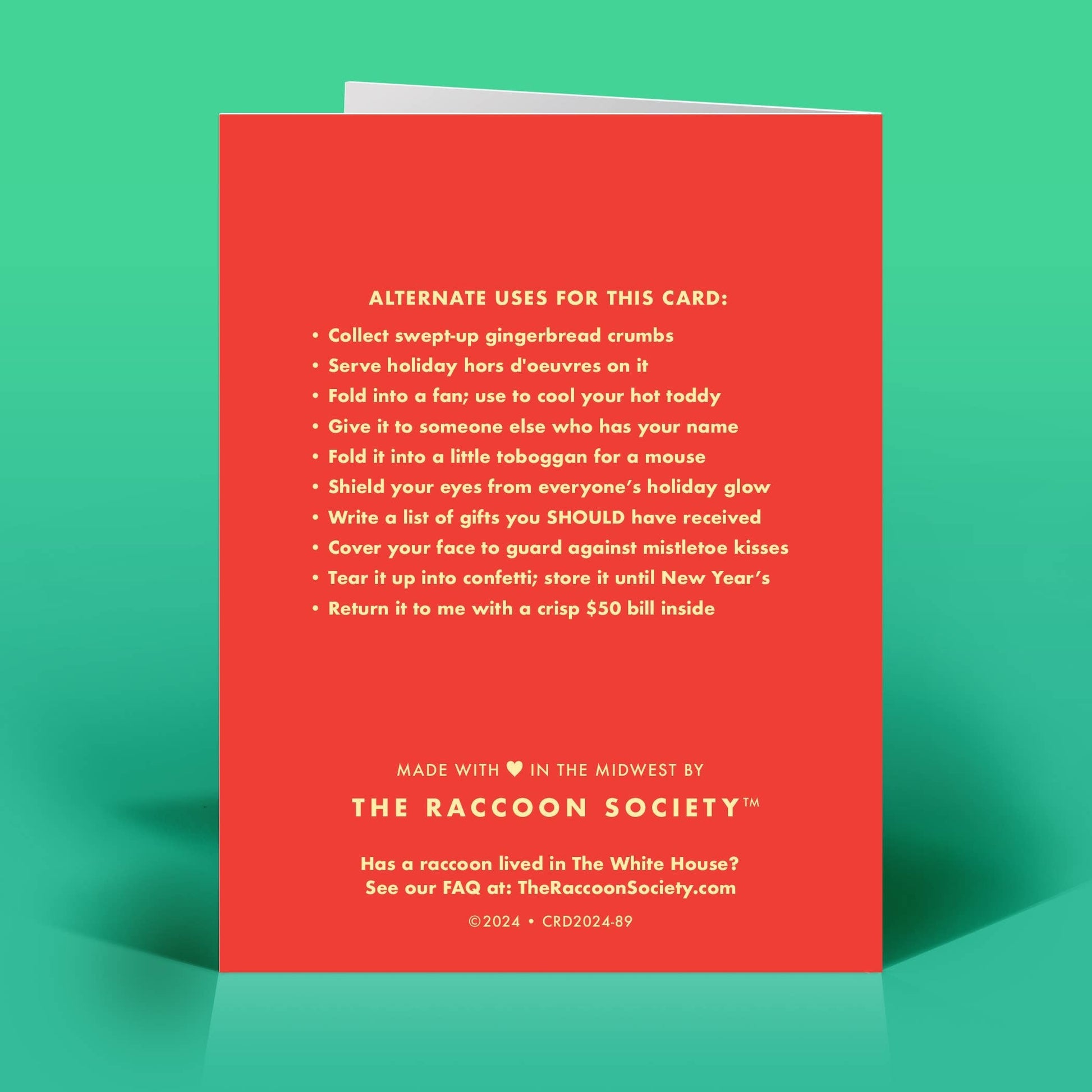 Mellow Monkey funny Christmas card back featuring a list of humorous alternate uses printed on red recycled paper.