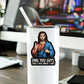 Mellow Monkey waterproof vinyl sticker featuring a humorous Jesus illustration on a white tumbler on a desk.