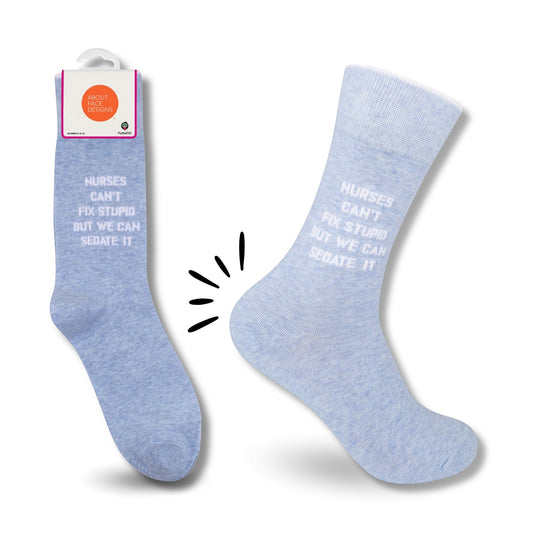 Mellow Monkey light blue novelty socks with white text reading Nurses Can't Fix Stupid But We Can Sedate It