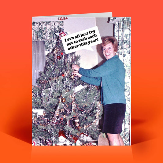 Mellow Monkey funny Christmas card featuring a vintage photo of a woman decorating a tree with dark humor text.