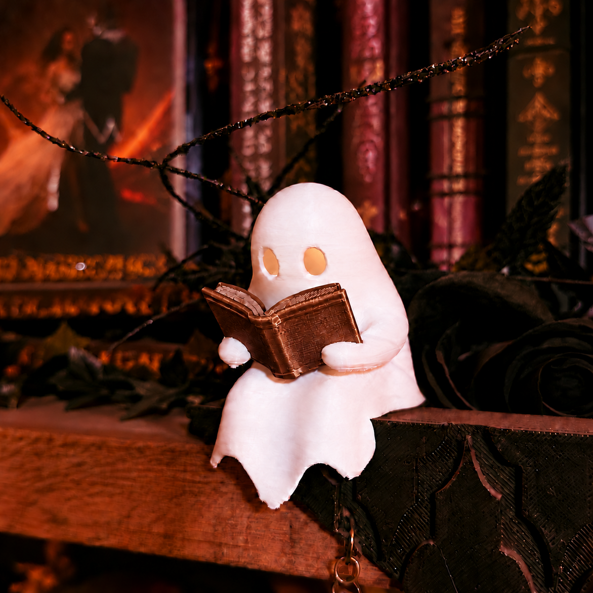 Mellow Monkey Ghost Book Reader figurine with a brown book and glowing LED tealight on a dark bookshelf.