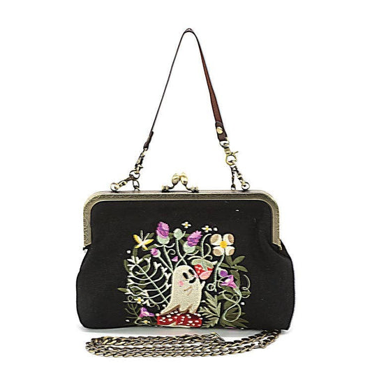 Mellow Monkey black linen blend kisslock handbag featuring embroidered ghost and strawberry field design.