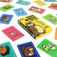 Mellow Monkey Giant Beaver! Tiny Ass! card game box with colourful illustrated animal cards spread on a white surface