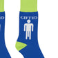 Mellow Monkey Gifted crew socks in blue with lime green cuffs and heels, featuring a white stick figure graphic.