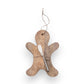 Mellow Monkey gingerbread man shaped mango wood serving board with a matching canape knife tied with jute twine.