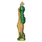 Mellow Monkey Old World Christmas blown glass giraffe ornament with green tree detail, 5.5-in