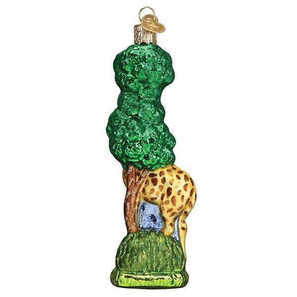 Mellow Monkey Old World Christmas blown glass giraffe ornament with green tree and brown spots, 5.5-in