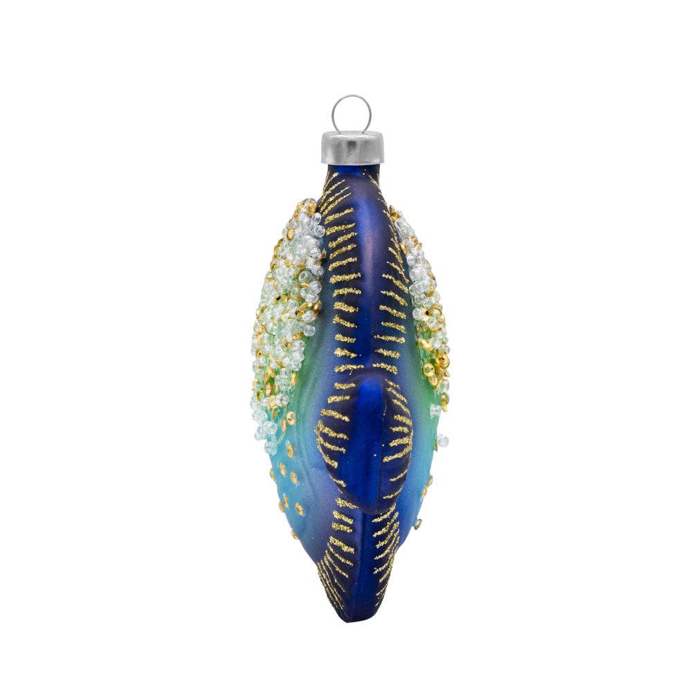 Mellow Monkey glass fish ornament in blue and green with gold glitter and shimmering bead accents on a white background