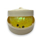 Mellow Monkey yellow glitter dumpling stress toy with a cute face inside a small plastic steamer basket container.
