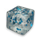 Mellow Monkey 2-inch clear squishy cube filled with blue and silver snowflake glitter for stress relief and fidgeting.