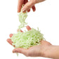 Mellow Monkey glow in the dark jiggle worms being held in hands for sensory tactile play