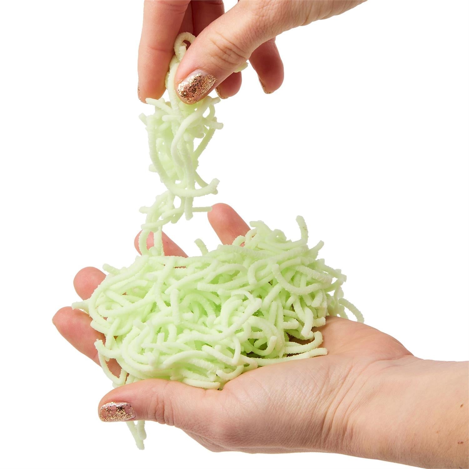 Mellow Monkey glow in the dark jiggle worms being held in hands for sensory tactile play