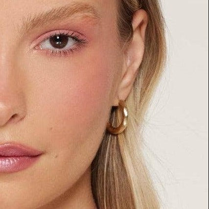 Mellow Monkey gold plated bamboo hoop earrings with organic texture and sterling silver posts.