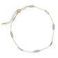 Mellow Monkey gold chain anklet featuring grey-blue cylindrical beads, perfect for a coastal beachy style.